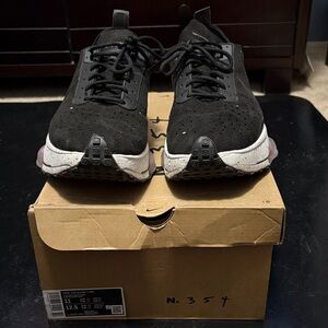 This is a Nike Air Zoom-Type sneaker in a black colorway